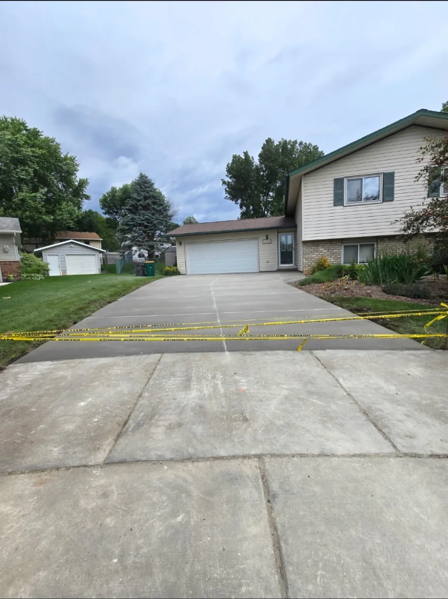 Split-level concrete driveway taped off before stamping in southern Minnesota
