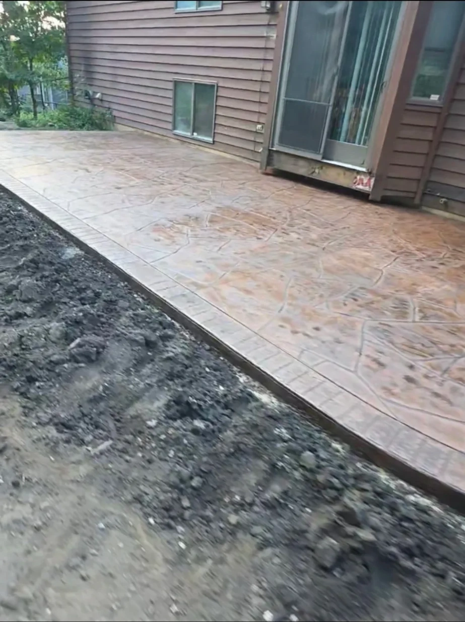 Stamped concrete walkway with a rust wash finish in Owatonna, MN
